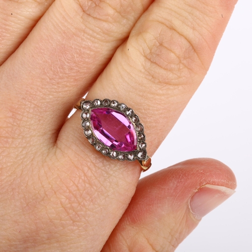 1128 - A pink sapphire and diamond marquise cluster ring, unmarked gold settings with marquise-shape pink s... 