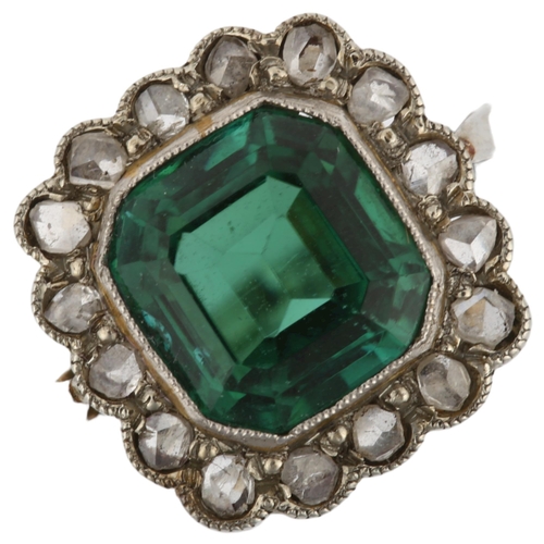 1129 - An 18ct white gold green tourmaline and diamond cluster ring, set with octagonal step-cut tourmaline... 