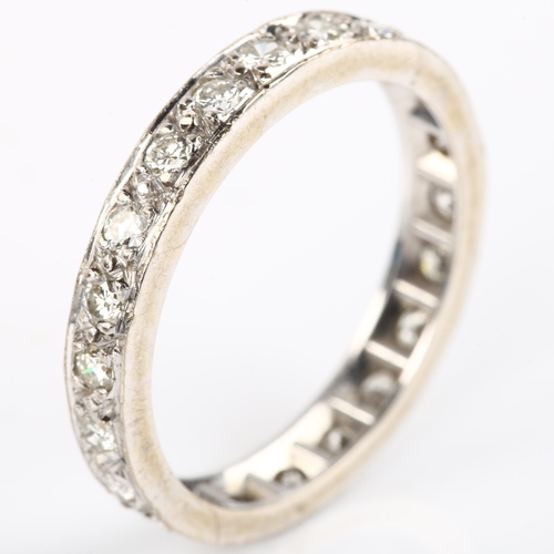 1132 - A full eternity diamond ring, unmarked white metal settings with modern round brilliant-cut diamonds... 