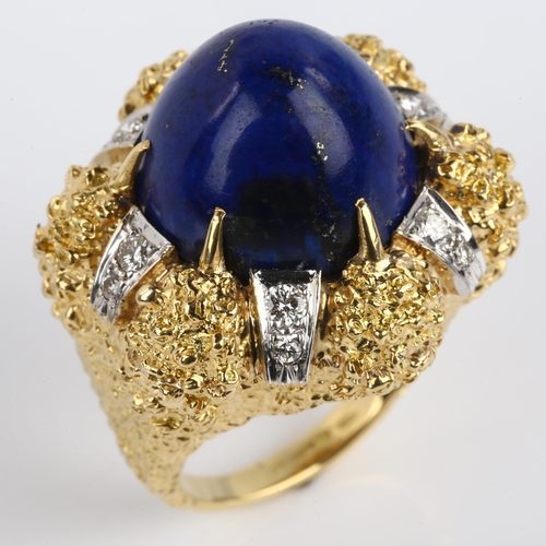 1134 - A large 18ct gold lapis lazuli and diamond cocktail ring, textured claw setting with high bullet cab... 