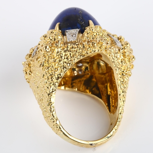 1134 - A large 18ct gold lapis lazuli and diamond cocktail ring, textured claw setting with high bullet cab... 