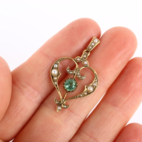 1135 - An Art Nouveau Edwardian 15ct gold green paste and split pearl openwork heart pendant, pendant heigh... 