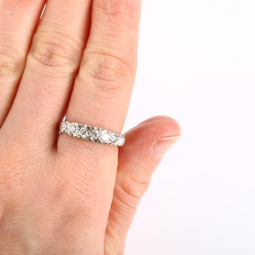 1136 - An 18ct white gold seven stone diamond half eternity ring, set with modern round brilliant-cut diamo... 