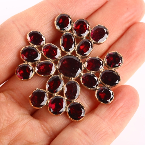 1144 - A large Victorian flat-top garnet Maltese Cross brooch, unmarked rose metal closed-back settings, br... 