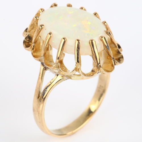 1162 - A Continental 18ct gold white opal dress ring, basket set with oval cabochon opal, opal measures: 14... 