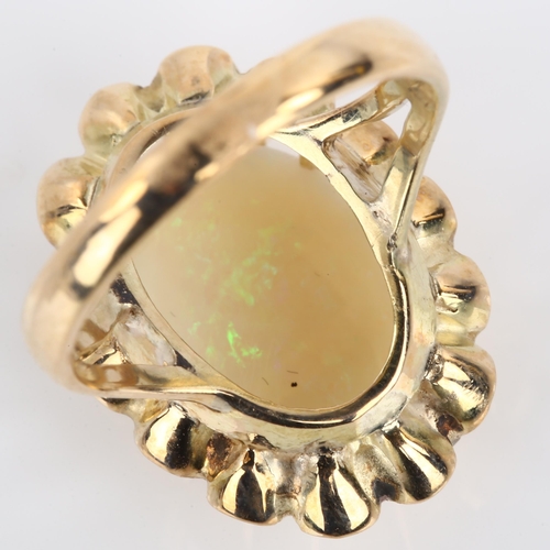 1162 - A Continental 18ct gold white opal dress ring, basket set with oval cabochon opal, opal measures: 14... 