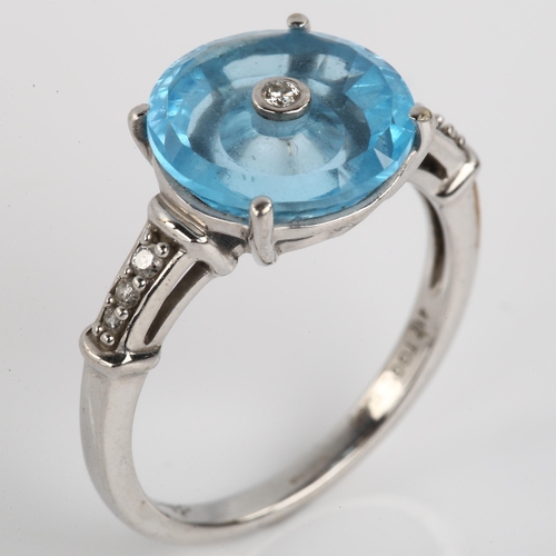 1164 - A modern 9ct white gold blue topaz and diamond tablet dress ring, set with modern round brilliant-cu... 