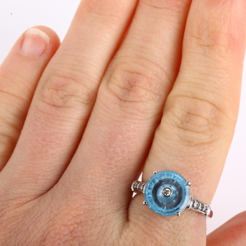 1164 - A modern 9ct white gold blue topaz and diamond tablet dress ring, set with modern round brilliant-cu... 