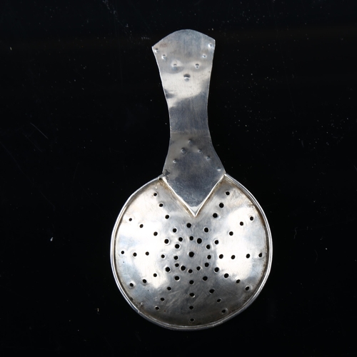 1680 - An Arts and Crafts unmarked silver tea caddy strainer spoon, length 10cm