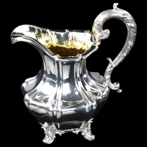 1702 - A William IV silver pumpkin cream jug, baluster form with acanthus handle and gilt interior, by Barn... 