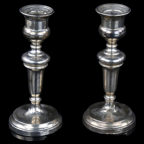 1708 - A pair of George V silver table candlesticks, by Edward Barnard & Sons, hallmarks London 1912, heigh... 