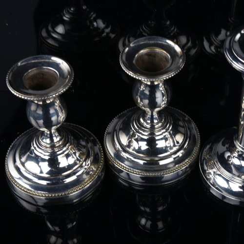 1710 - A pair of Edwardian silver plain form table candlesticks, hallmarks Birmingham 1906, height 11.5cm, ... 