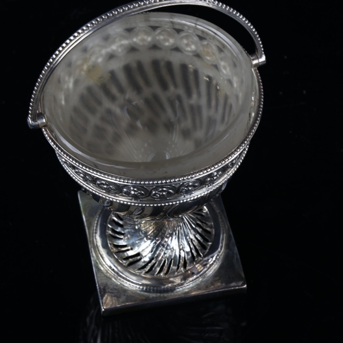 1711 - A 19th century swing-handled sugar basket, unmarked silver with pierced floral decoration, height ex... 