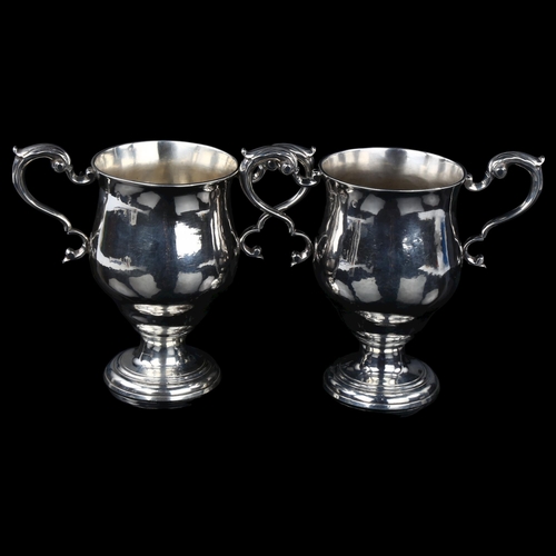 1717 - A pair of Irish George III silver 2-handled presentation trophy cups, circular bulbous form with scr... 