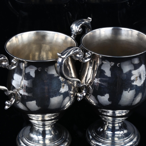 1717 - A pair of Irish George III silver 2-handled presentation trophy cups, circular bulbous form with scr... 