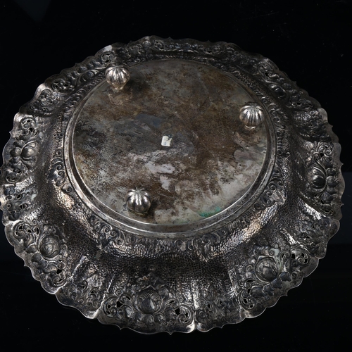 1721 - A large Continental 800 silver fruit bowl, relief embossed and pierced decoration with scalloped rim... 