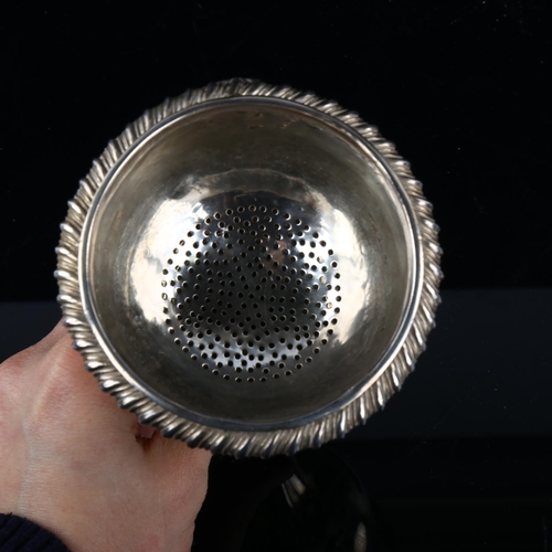 1722 - A George IV silver wine funnel, with strainer insert, gadrooned rim and shell clip, by Rebecca Emes ... 