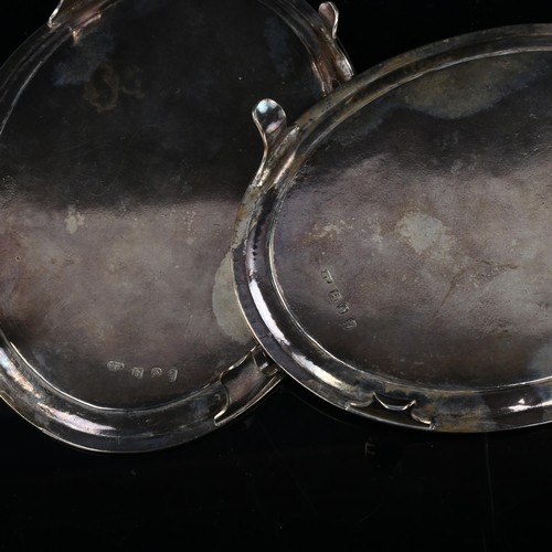 1724 - A pair of Irish George III silver oval teapot stands, with engraved armorial crests, by Robert Bread... 