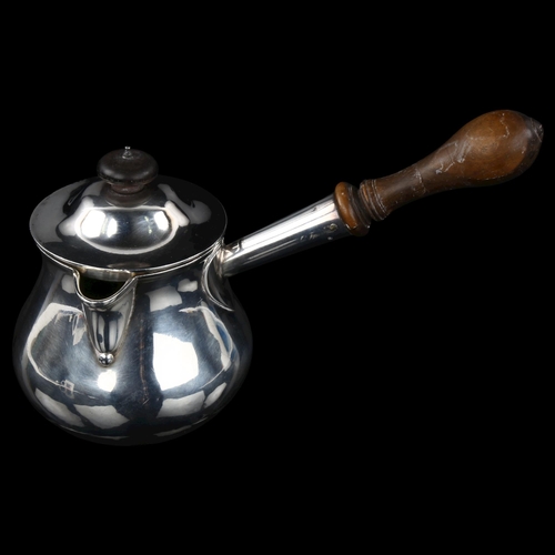 1727 - A George III silver Brandy pan, circular baluster form with side pouring turned wood handle and hear... 