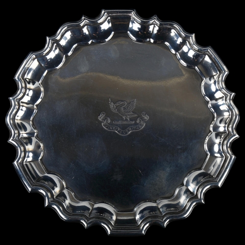 1740 - An Edwardian silver salver, circular form with scalloped rim and swan crest 