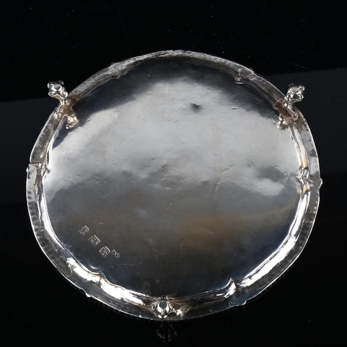 1742 - A George III silver salver, circular form with bead edge, raised on claw and ball feet, by Robert Jo... 