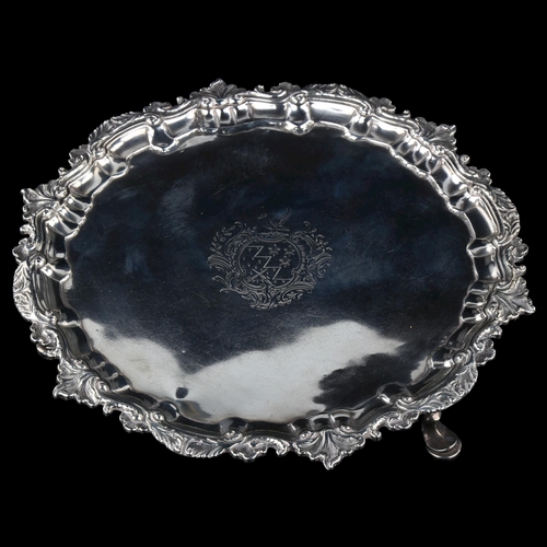 1743 - An Irish George III silver salver, circular form with cast foliate rim, raised on 3 feet, by George ... 