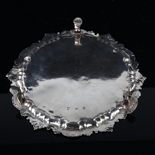 1743 - An Irish George III silver salver, circular form with cast foliate rim, raised on 3 feet, by George ... 