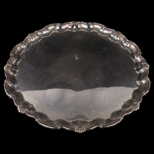 1745 - A large George V silver salver, circular form with piecrust edge and cast foliate rim with scrolled ... 