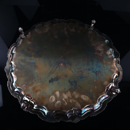 1745 - A large George V silver salver, circular form with piecrust edge and cast foliate rim with scrolled ... 