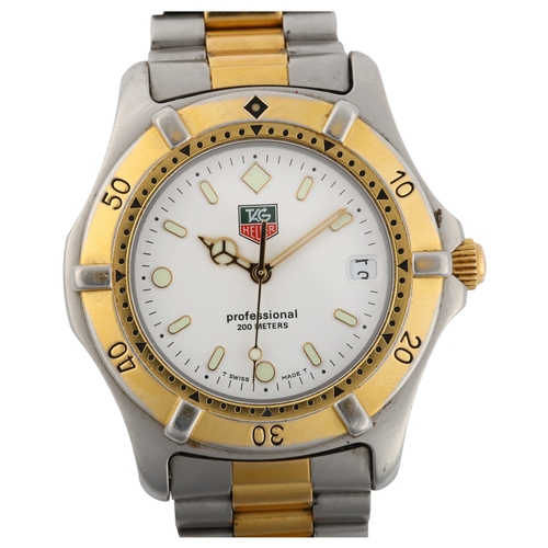 1084 - TAG HEUER - a gold plated stainless steel Professional 2000 Series quartz bracelet watch, ref. WE112... 