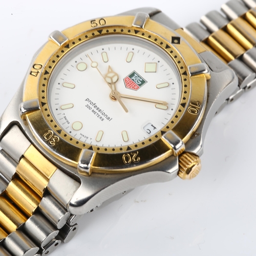 1084 - TAG HEUER - a gold plated stainless steel Professional 2000 Series quartz bracelet watch, ref. WE112... 