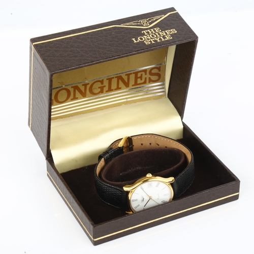 1086 - LONGINES - a gold plated stainless steel quartz wristwatch, white dial with Roman numeral hour marke... 