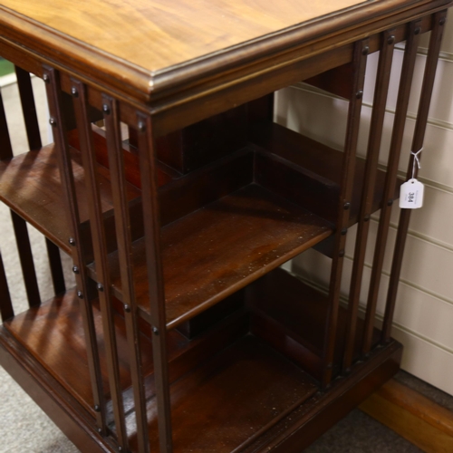 384 - An Edwardian mahogany revolving bookcase, height 86cm, 50cm Sq