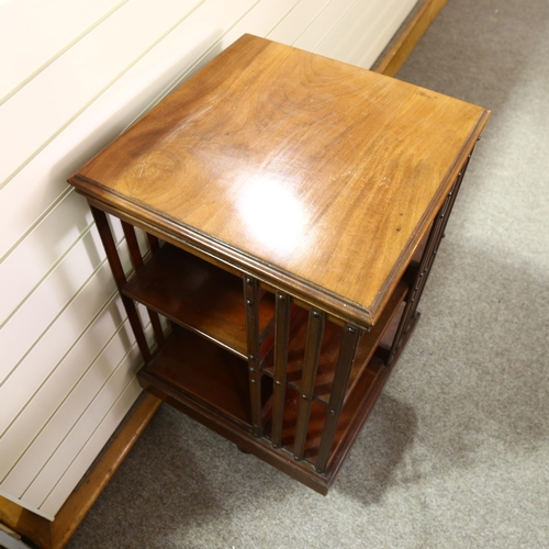 384 - An Edwardian mahogany revolving bookcase, height 86cm, 50cm Sq