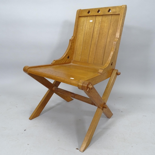 2079 - An oak Glastonbury style chair, 60cm x 89cm x 60cm