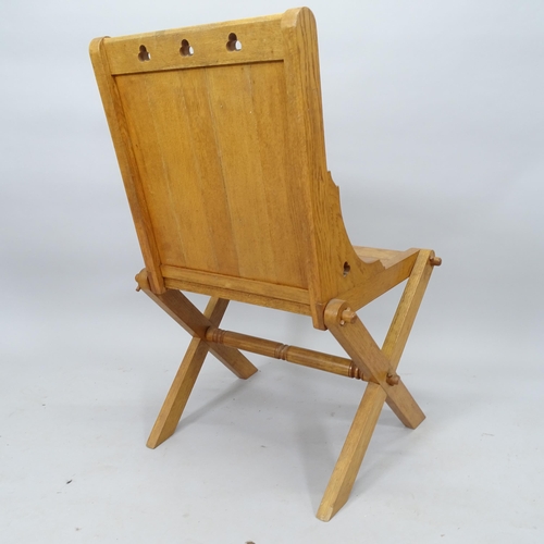 2079 - An oak Glastonbury style chair, 60cm x 89cm x 60cm