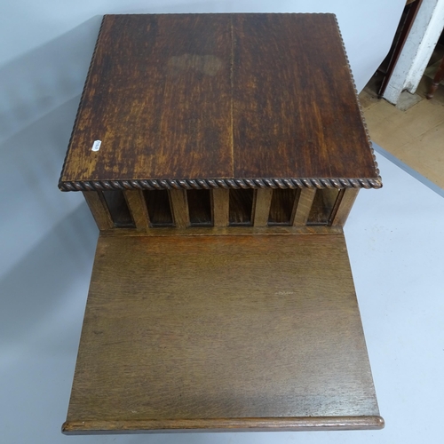 2049 - An Oak revolving 3 tier bookcase with adjustable book stand.   55 x 105cm.