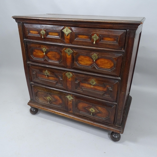 2050 - A Jacobean oak chest of 4 long drawers on bun feet. 100 x 100 x 59cm.