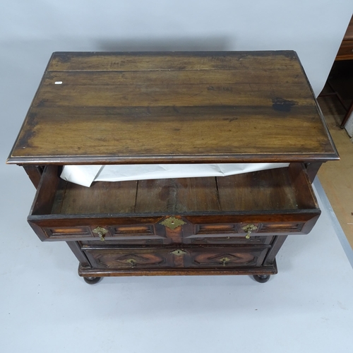 2050 - A Jacobean oak chest of 4 long drawers on bun feet. 100 x 100 x 59cm.