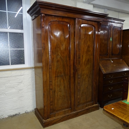 2051 - A Victorian mahogany linen press, with drawer and slide fitted interior and detachable base and corn... 