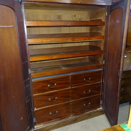 2051 - A Victorian mahogany linen press, with drawer and slide fitted interior and detachable base and corn... 