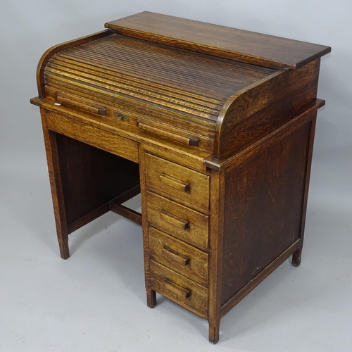 2056 - A 1930s single pedestal tambour front roll top desk, 93cm x 99cm x 71cm (with key)