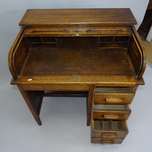 2056 - A 1930s single pedestal tambour front roll top desk, 93cm x 99cm x 71cm (with key)