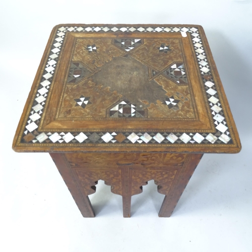 2059 - A Moorish hardwood square topped occasional table with carved and inlaid mother of pearl decoration,... 