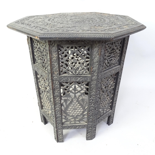 2060 - An Anglo-Indian octagonal occasional table with carved and pierced decoration, 54cm x 56cm