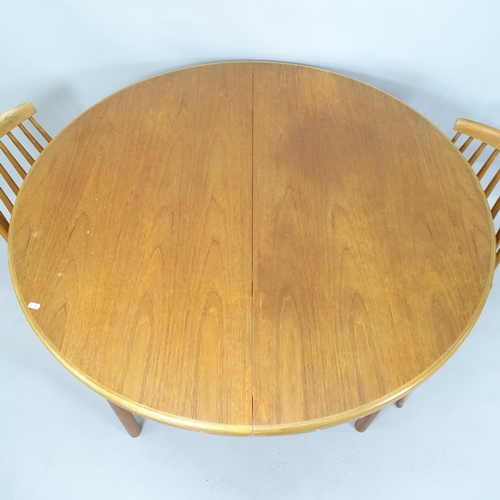 2062 - A mid-century Macintosh teak circular extending dining table, 122cm extending to 167cm x 76cm, and a... 