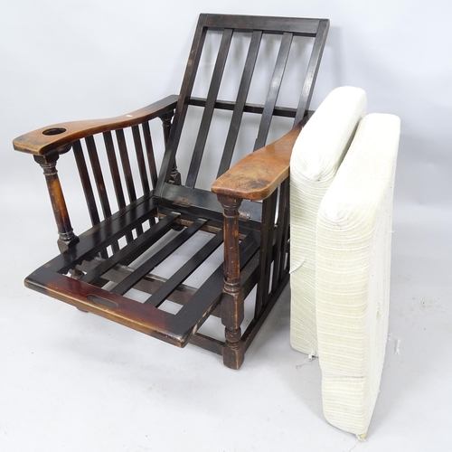 2063 - An Oak Arts and Crafts style reclining armchair. 74 x 92 x 74cm.