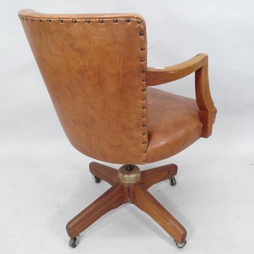 2081 - A 20th century Brown leather upholstered swivel desk chair.