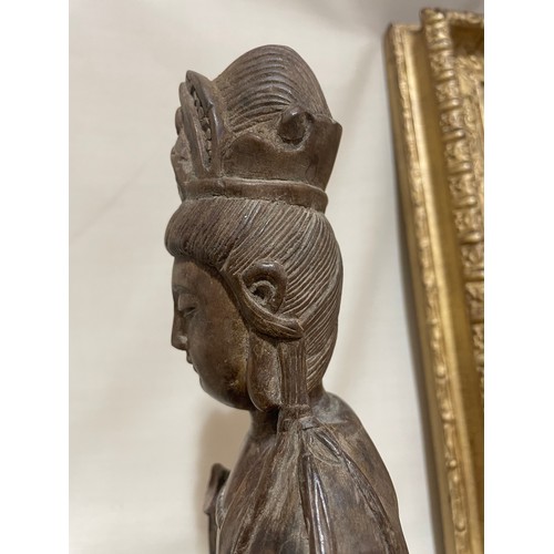 287 - An Antique Oriental carved wood Buddha, on later slate base, height 26cm