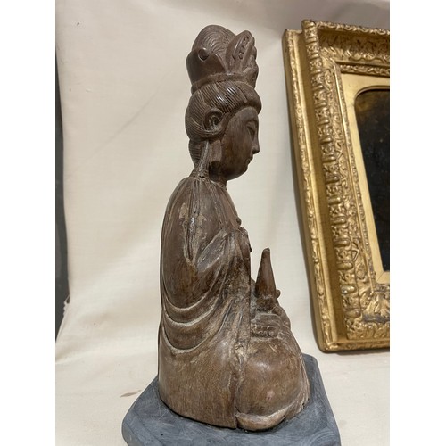 287 - An Antique Oriental carved wood Buddha, on later slate base, height 26cm